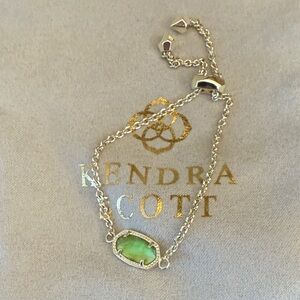 Kendra Scott slide bracelet with green stone